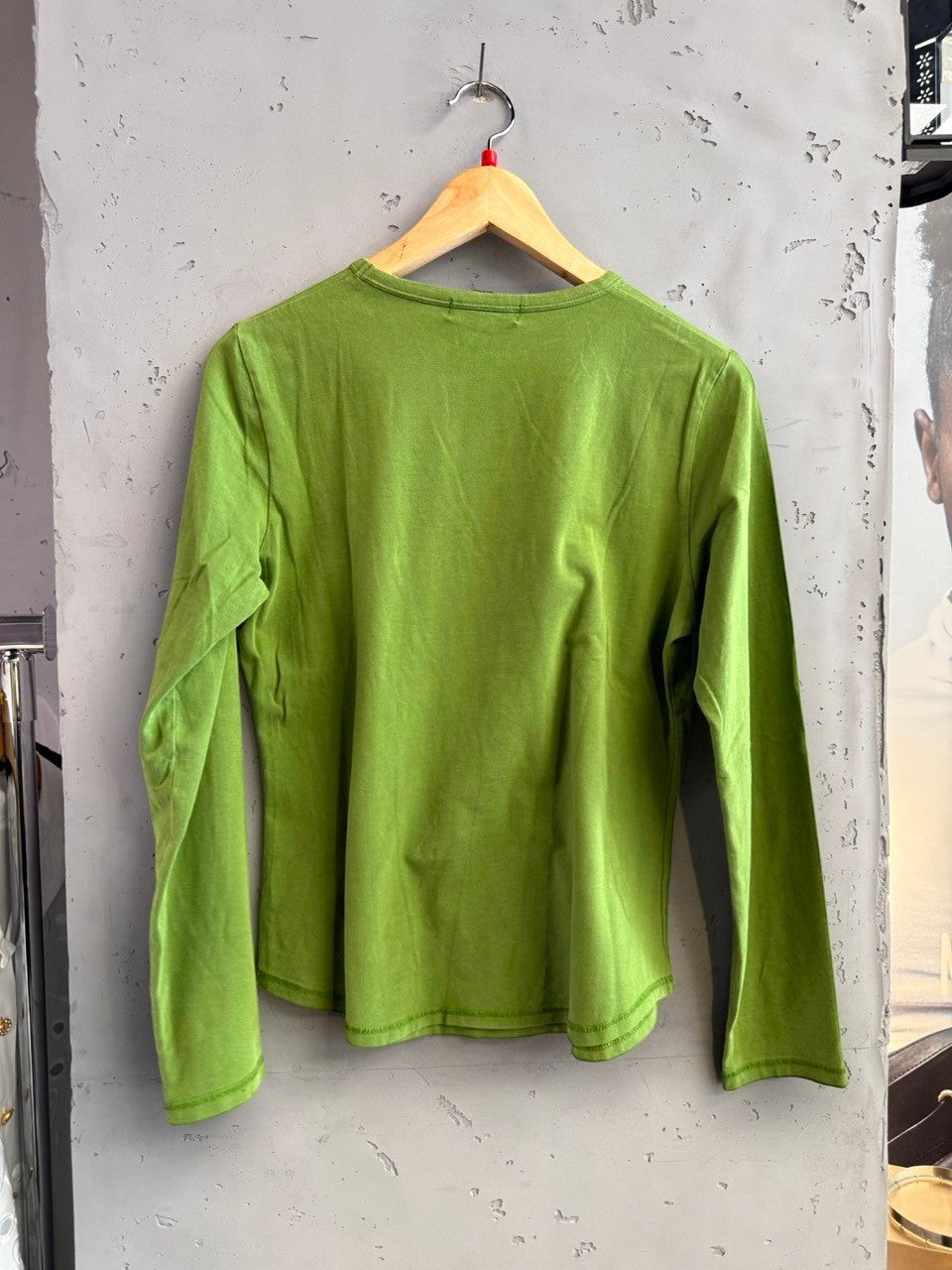 BERLIN VINTAGE CORNER lime green long sleeve t-shirt with Minnie Mouse graphic and rhinestone bow.