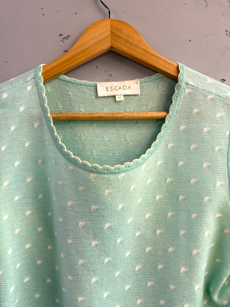 BERLIN VINTAGE CORNER mint green knit sleeveless top with white polka dots and scalloped trim.