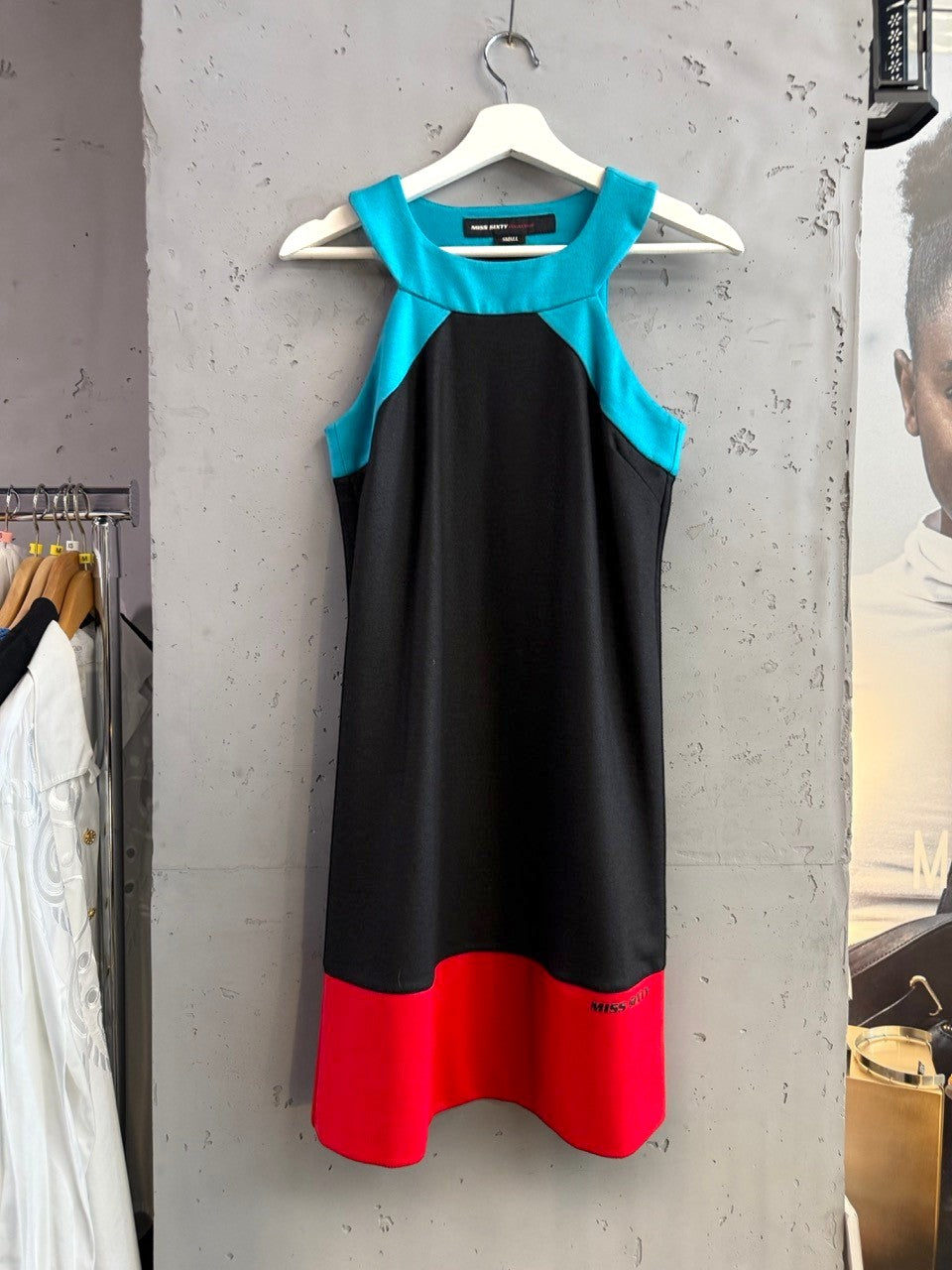 BERLIN VINTAGE CORNER Miss Sixty black mini dress with turquoise neckline and red hem. Sleeveless A-line with unique neckline.