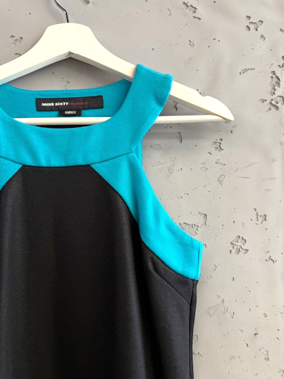 BERLIN VINTAGE CORNER Miss Sixty black mini dress with turquoise neckline and red hem. Sleeveless A-line.