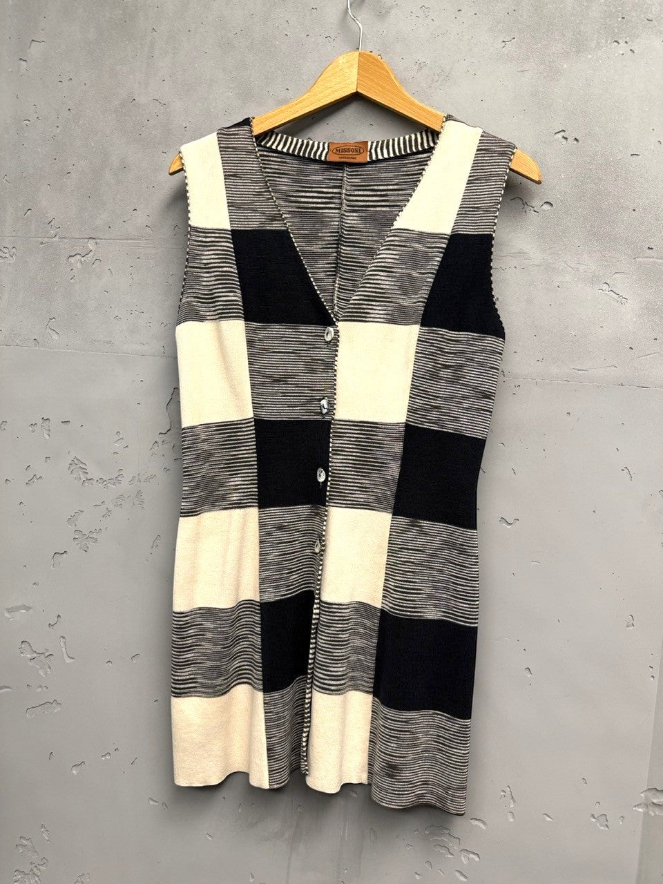 BERLIN VINTAGE CORNER Missoni sleeveless knit vest with black, white, and cream checkerboard pattern, V-neck, and shell buttons.