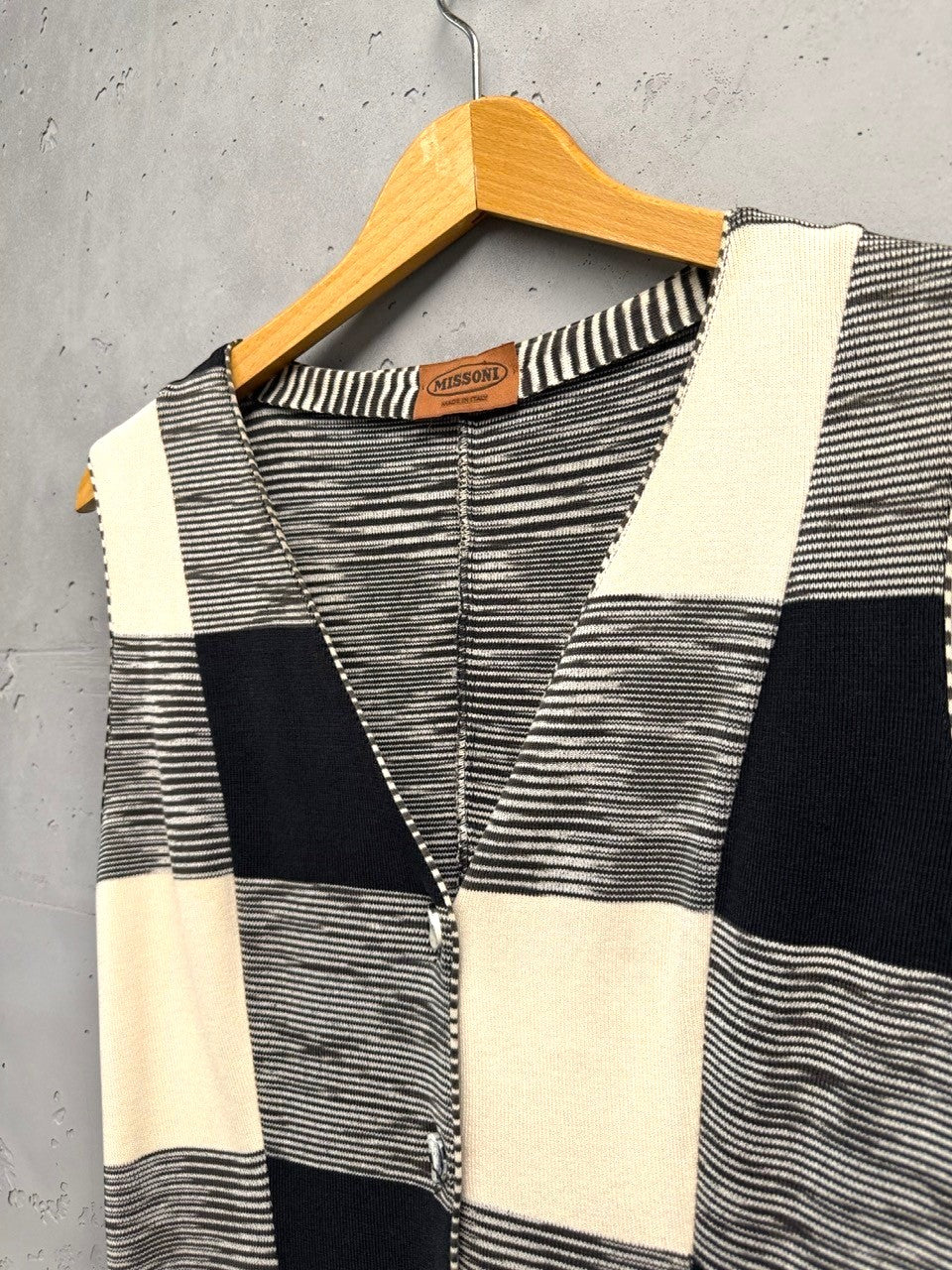 BERLIN VINTAGE CORNER Missoni sleeveless knit vest with black, white, and cream checkerboard pattern, V-neck, and shell buttons.