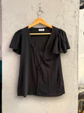 BERLIN VINTAGE CORNER black MOSCHINO CHEAPANDCHIC knit top with V-neck, tie-front detail, and flutter sleeves.