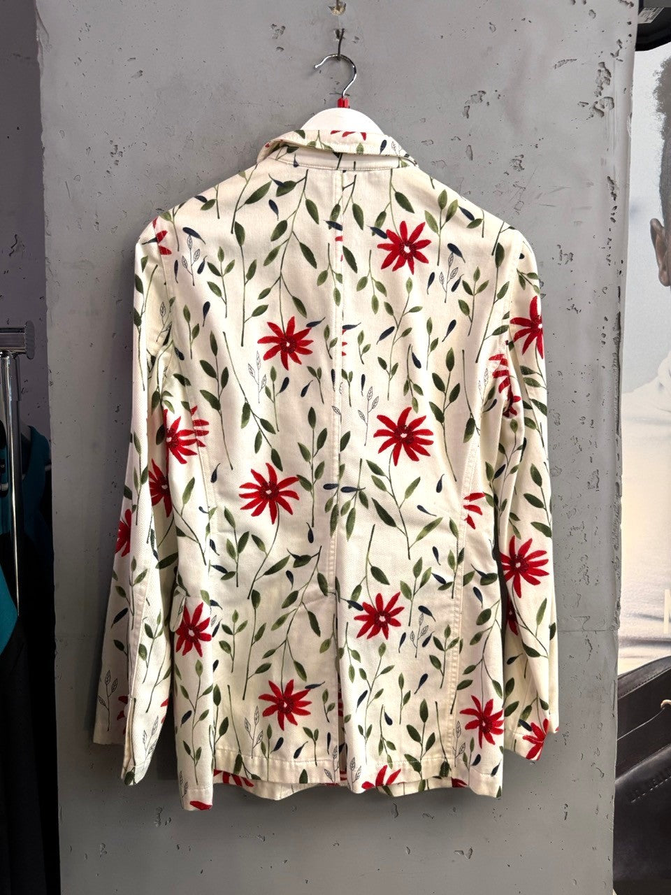 BERLIN VINTAGE CORNER Moschino denim blazer featuring an off-white base with red floral and green leaf print back view