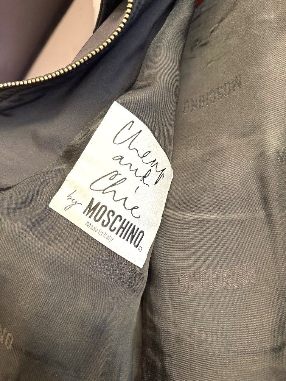 BERLIN VINTAGE CORNER black quilted detail zip up jacket with "Cheap and Chic by MOSCHINO" label.