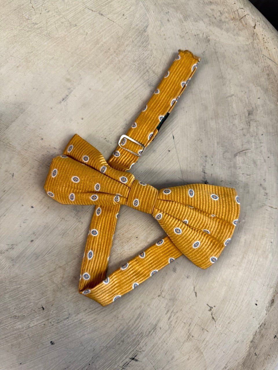 BERLIN VINTAGE CORNER mustard yellow corduroy bow tie with blue and white oval pattern, adjustable strap.