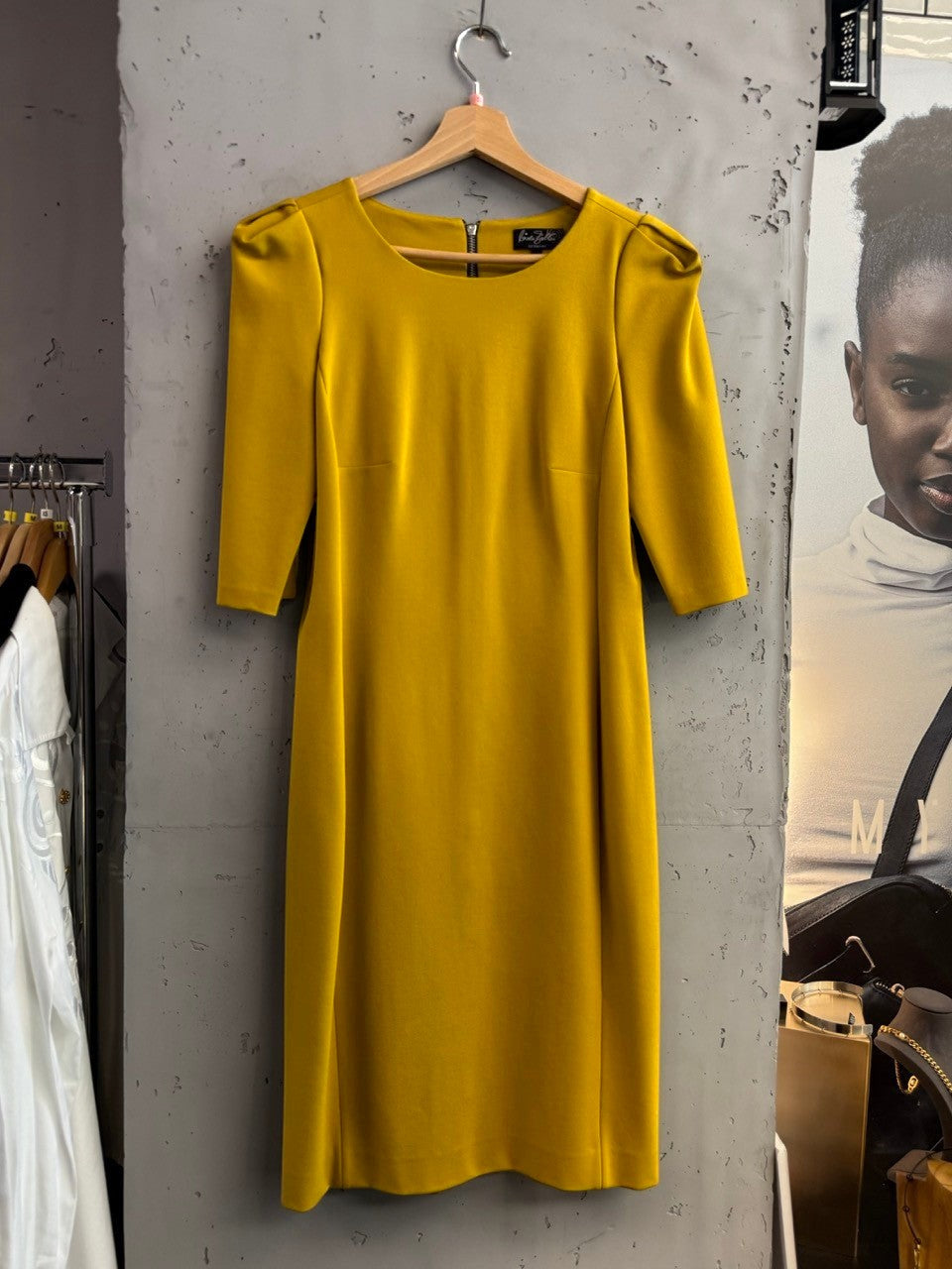 BERLIN VINTAGE CORNER mustard yellow midi sheath dress with elbow-length sleeves and silver zipper detail.