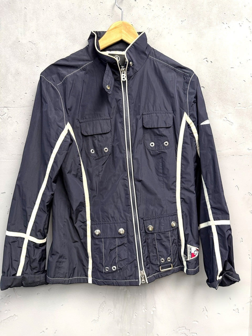 BERLIN VINTAGE CORNER navy blue lightweight racing jacket with cream piping, full zip, stand-up collar, and multiple pockets.