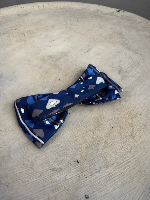 BERLIN VINTAGE CORNER navy blue silk bow tie with card suit pattern and white/grey border.