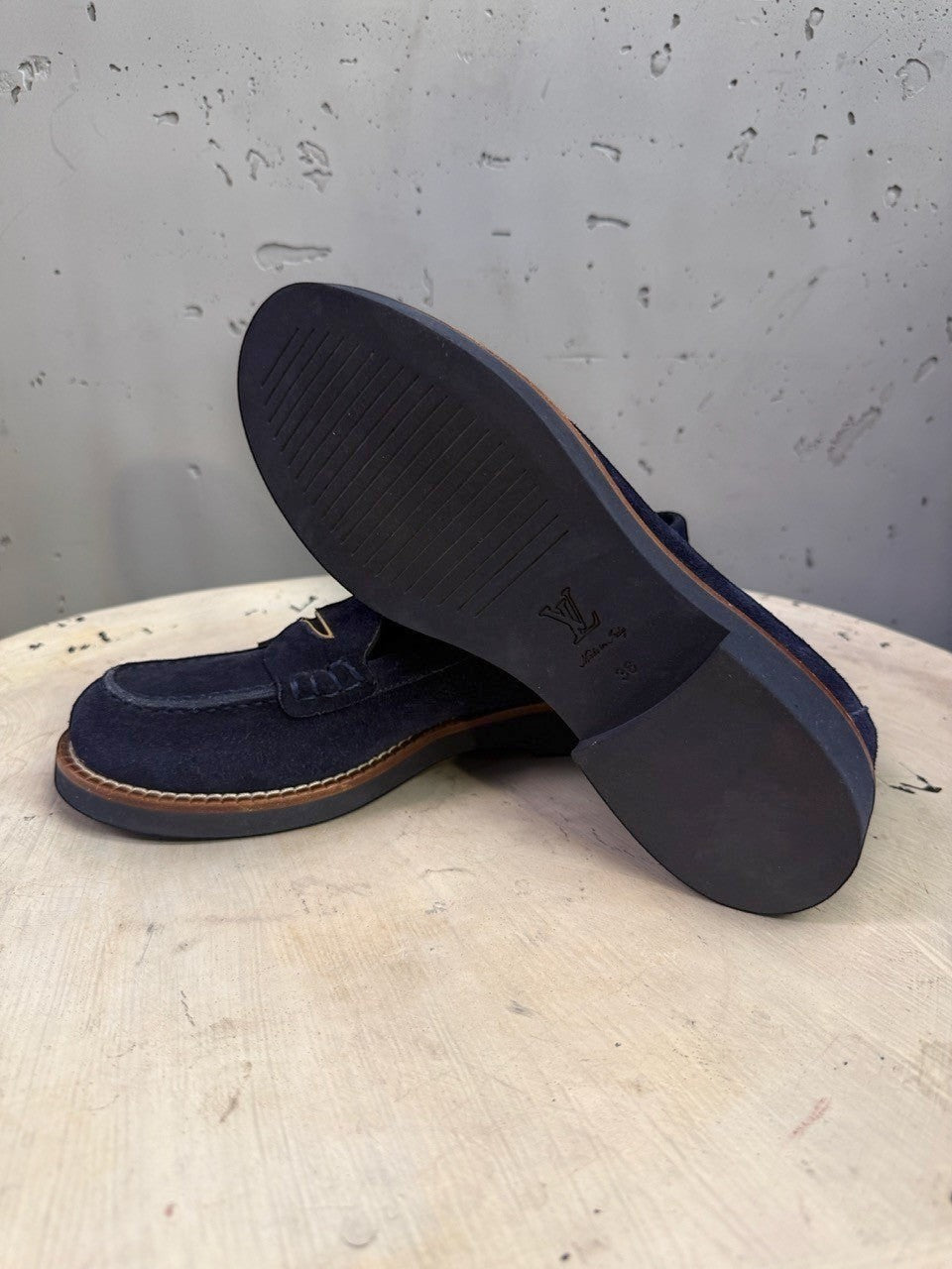 BERLIN VINTAGE CORNER navy blue suede Louis Vuitton loafers showing the durable rubber sole and contrast stitching.