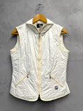BERLIN VINTAGE CORNER off-white quilted padded vest with zip front, stand-up collar, and zippered pockets.