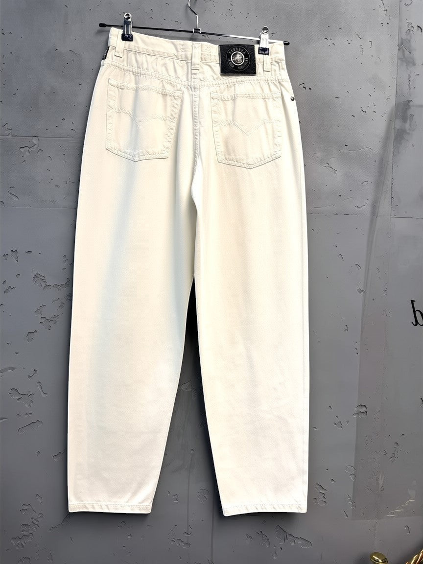 BERLIN VINTAGE CORNER off-white cotton denim jeans with five-pocket design and Versace branding.