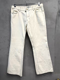 BERLIN VINTAGE CORNER Yves Saint Laurent off-white wide leg jeans with black stitching and five-pocket styling.
