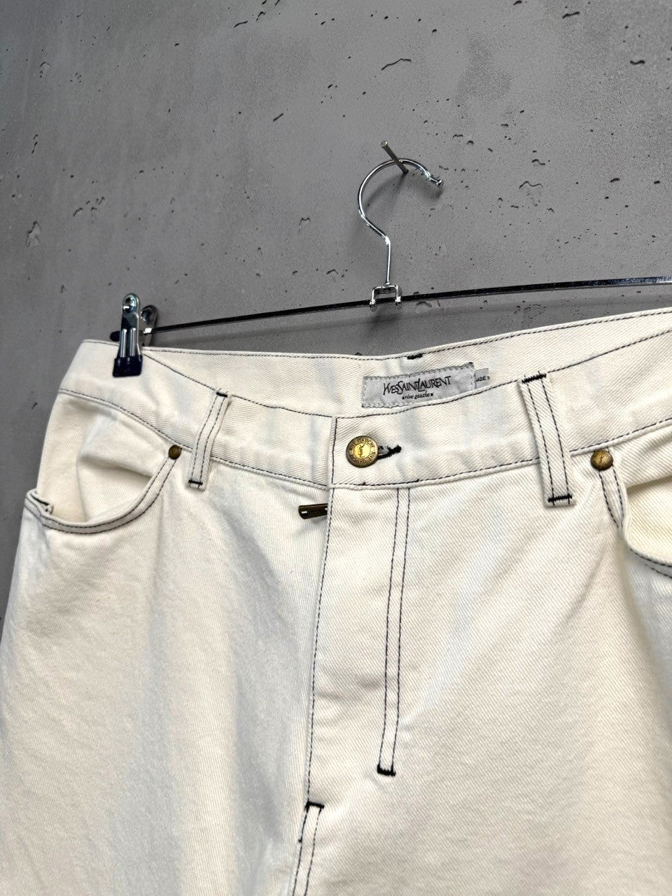 BERLIN VINTAGE CORNER Yves Saint Laurent off-white cotton wide leg jeans with black contrast stitching and five-pocket styling.