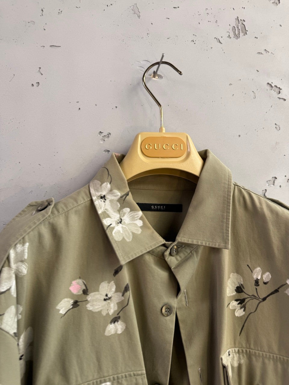 BERLIN VINTAGE CORNER olive green military style overshirt with hand-painted white and pink cherry blossoms on collar and front.