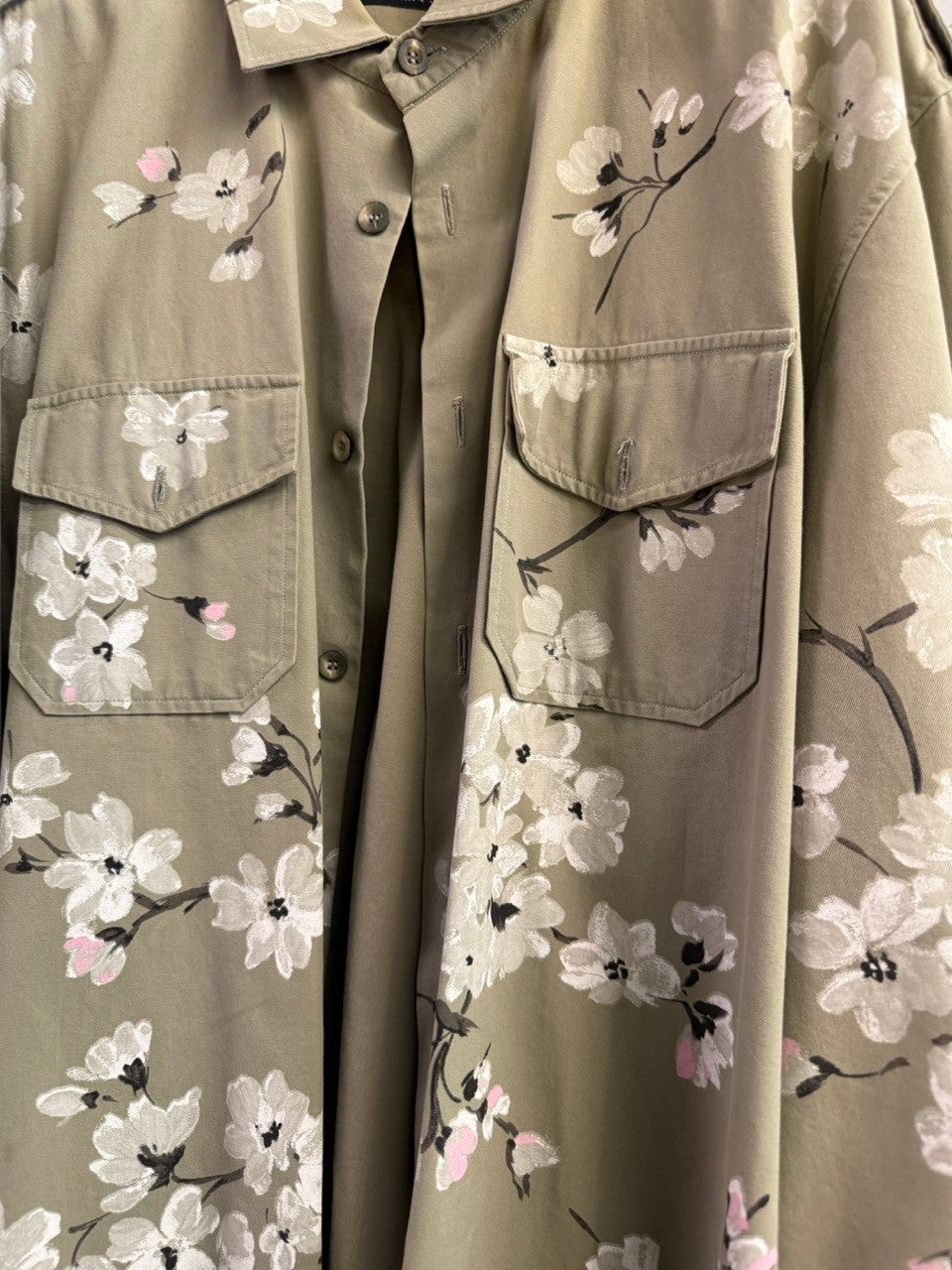 BERLIN VINTAGE CORNER olive green military style overshirt with hand-painted white and pink cherry blossoms on back and sleeves.