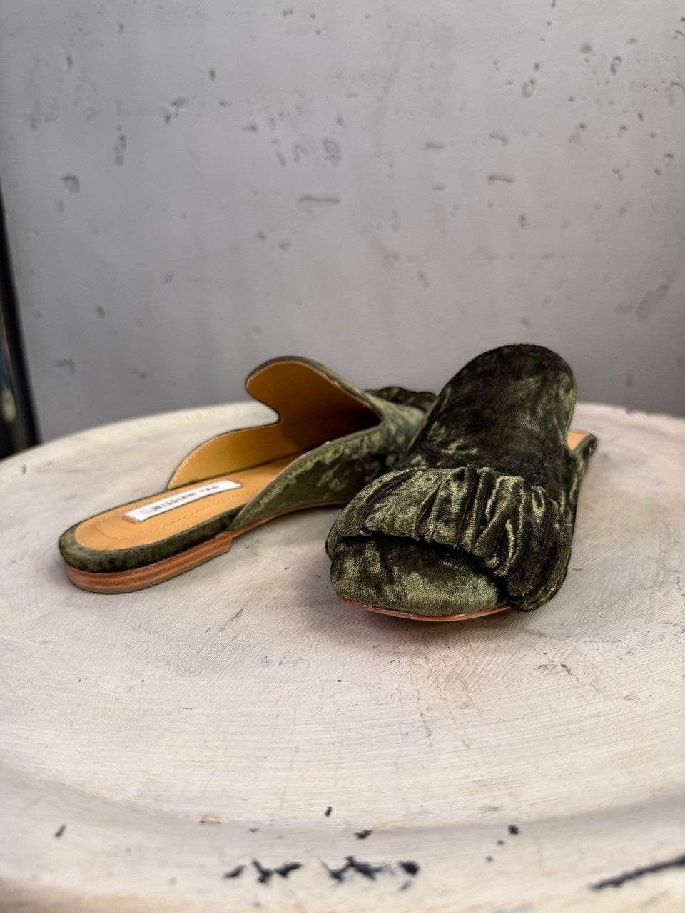 BERLIN VINTAGE CORNER olive green velvet ruched mule flats with pointed toe and gathered ruffle detail.