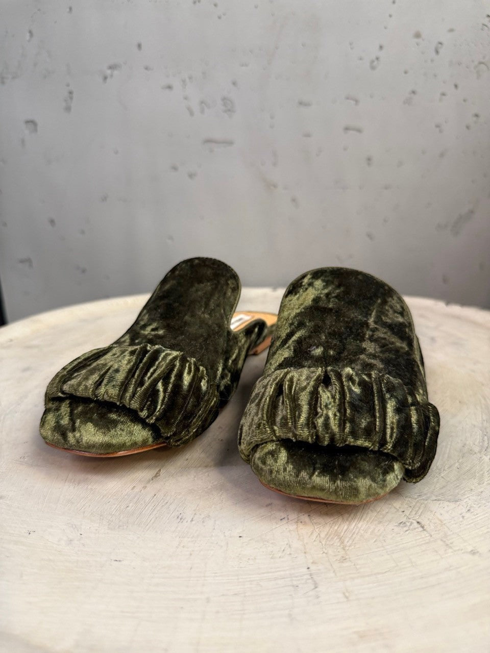 BERLIN VINTAGE CORNER olive green velvet ruched mule flats with pointed toe and ruffle detail.
