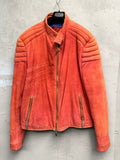 BERLIN VINTAGE CORNER orange suede moto jacket with quilted detailing on shoulders and sleeves, zip-front, and zippered pockets.