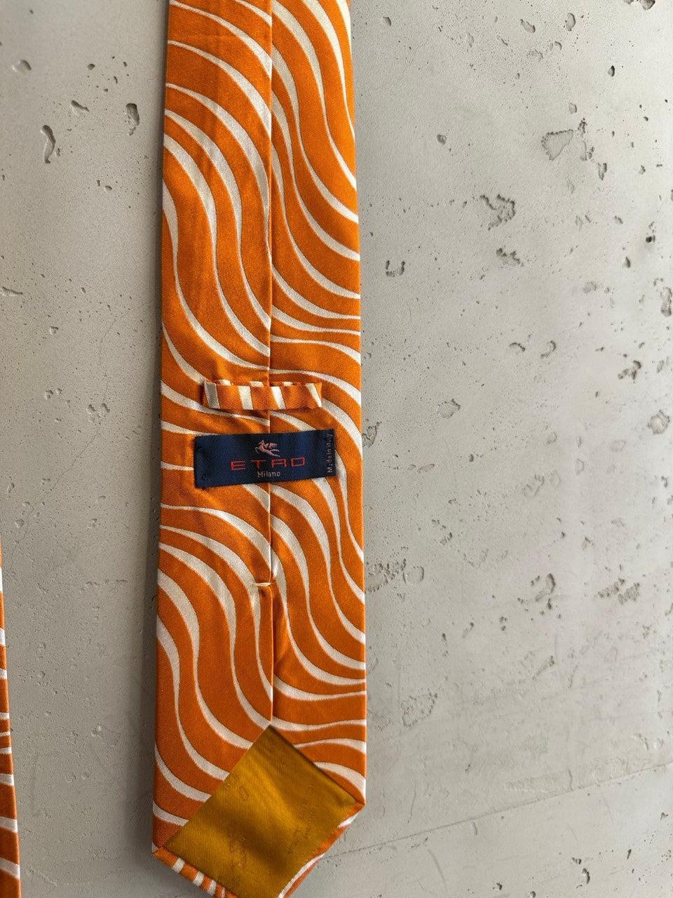 BERLIN VINTAGE CORNER orange and white silk necktie with a bold swirl pattern. Luxurious feel, perfect for formal or semi-formal outfits.
