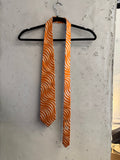 BERLIN VINTAGE CORNER orange and white silk necktie with a bold swirl pattern. Perfect for formal or semi-formal wear.