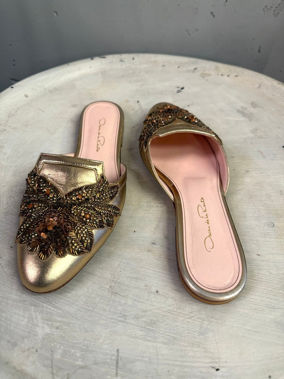 BERLIN VINTAGE CORNER Oscar de la Renta metallic gold leather flat mules with intricate floral bead and sequin vamp.