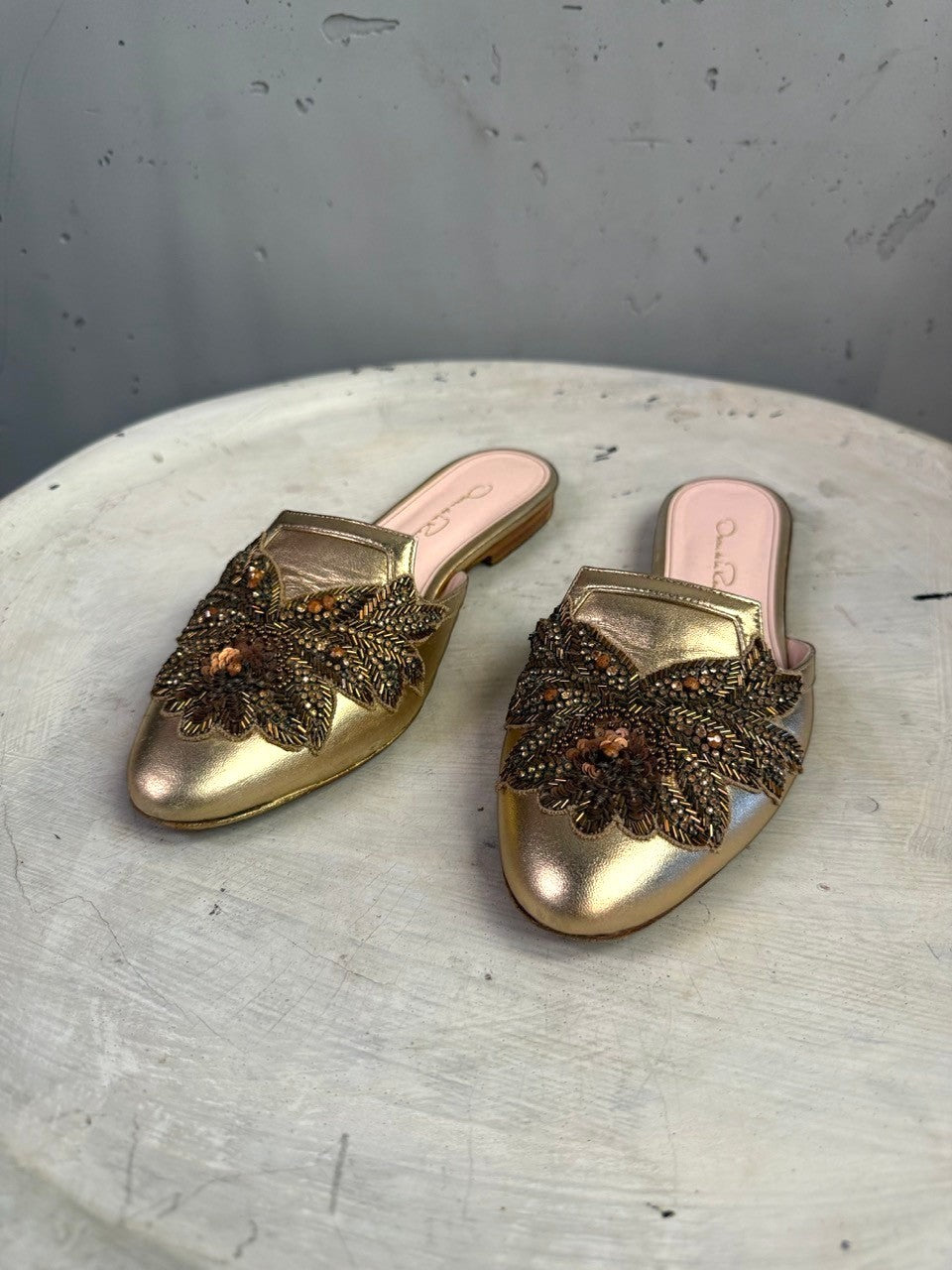 BERLIN VINTAGE CORNER Oscar de la Renta metallic gold leather flat mules with intricate floral bead and sequin vamp.