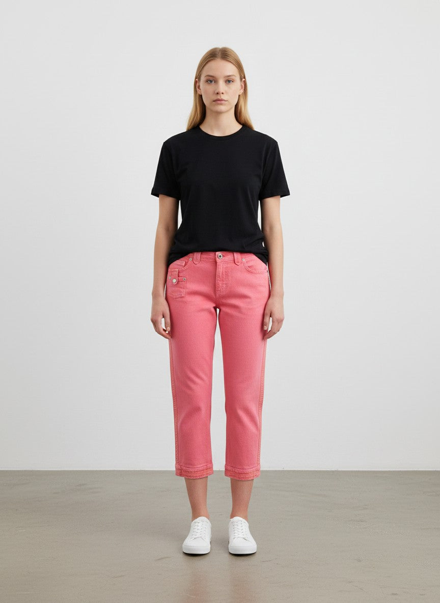 BERLIN VINTAGE CORNER coral pink denim cropped pants with textured side seams and five-pocket design.
