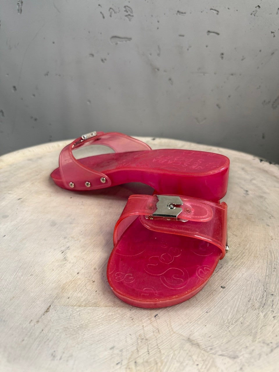 BERLIN VINTAGE CORNER pink translucent PVC jelly slide sandals with silver buckle and Escada Sport logo.