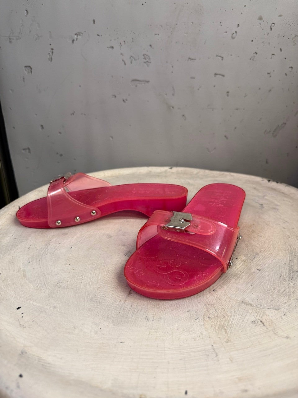 BERLIN VINTAGE CORNER pink PVC jelly slide sandals with silver buckle and logo detail.