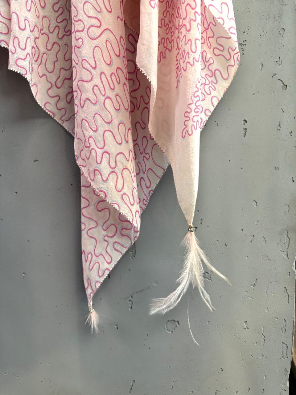 BERLIN VINTAGE CORNER kaftan top in light pink with squiggle pattern, crystal details, and feather-trimmed hem.
