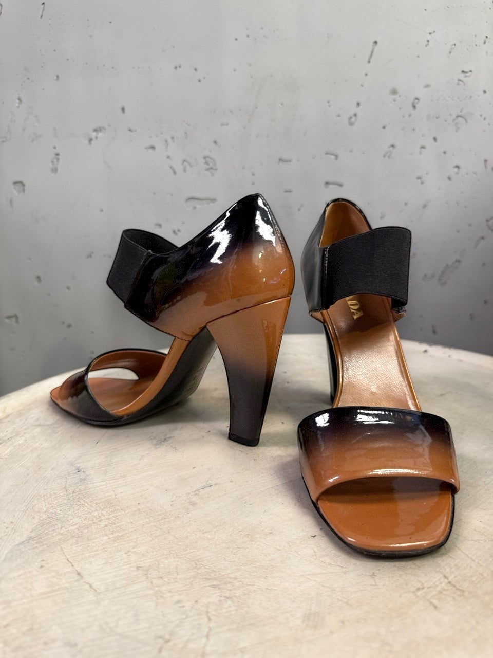 BERLIN VINTAGE CORNER Prada patent leather high heel sandals with an ombre tan and black finish and elastic straps.
