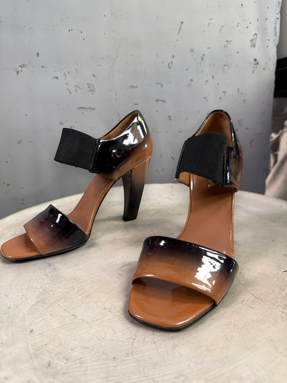 BERLIN VINTAGE CORNER Prada patent leather open-toe heels with a tan to black ombre finish and elasticized straps.