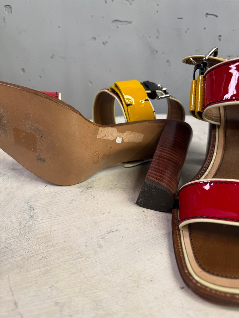 BERLIN VINTAGE CORNER Prada multi-colored patent leather block heel sandals with wood-grain effect heel and ankle strap.