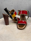 BERLIN VINTAGE CORNER Prada multi-colored patent leather block-heel sandals with wood-grain effect heels.