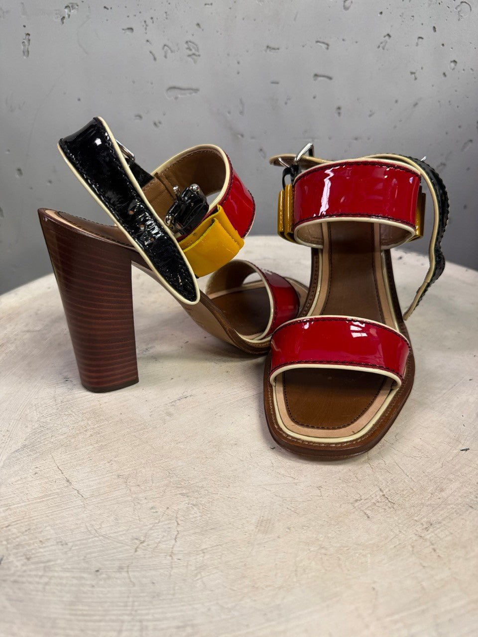 BERLIN VINTAGE CORNER Prada multi-colored patent leather block-heel sandals with wood-grain effect heels.