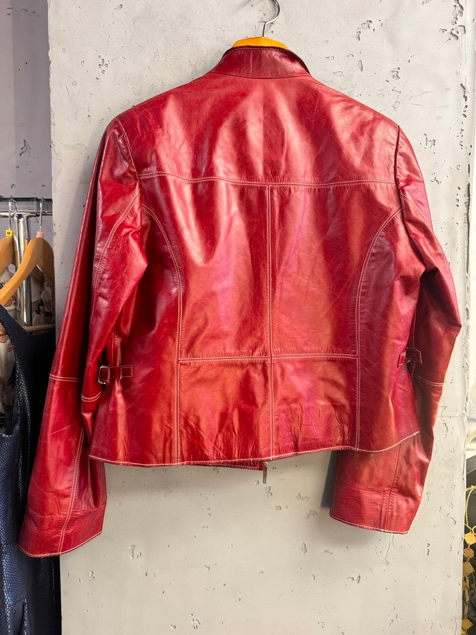 BERLIN VINTAGE CORNER Prada leather jacket seen from the back with waist tabs and princess seams.