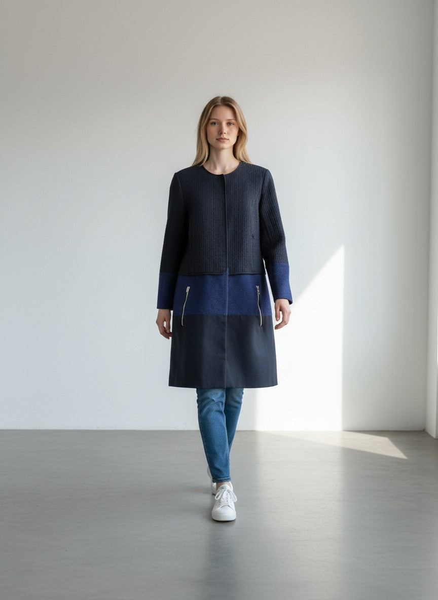 BERLIN VINTAGE CORNER navy quilted jacket with royal blue and navy colorblock skirt, gold zipper details.