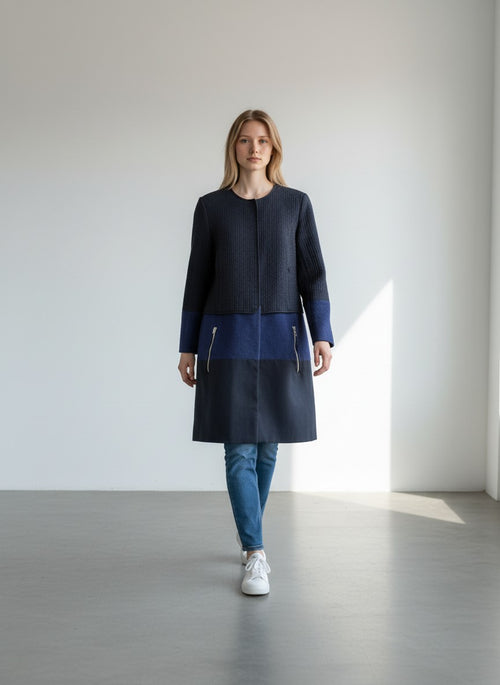 BERLIN VINTAGE CORNER navy quilted jacket with royal blue and navy colorblock skirt, gold zipper details.