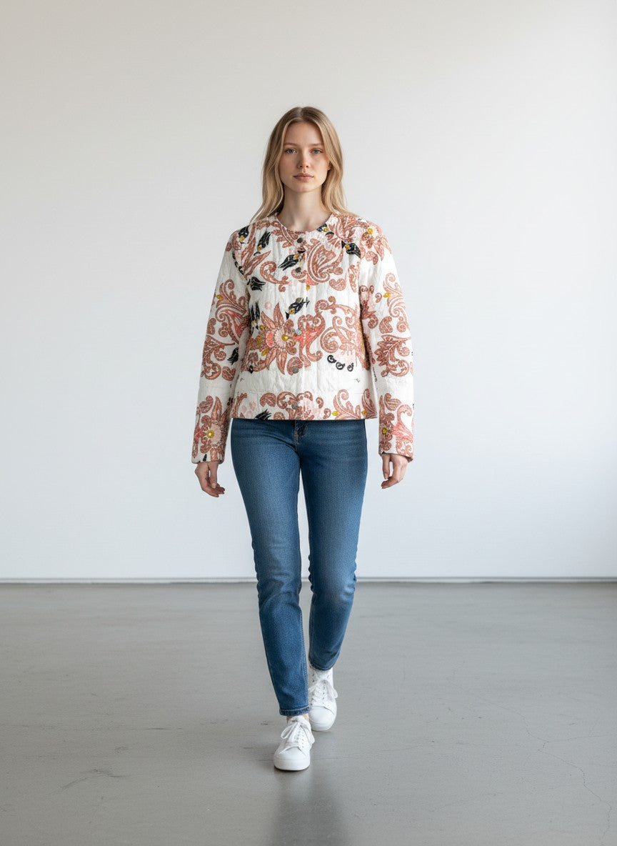 BERLIN VINTAGE CORNER quilted jacket with paisley and floral print in pink, black, and yellow on white. Round neckline, button front.