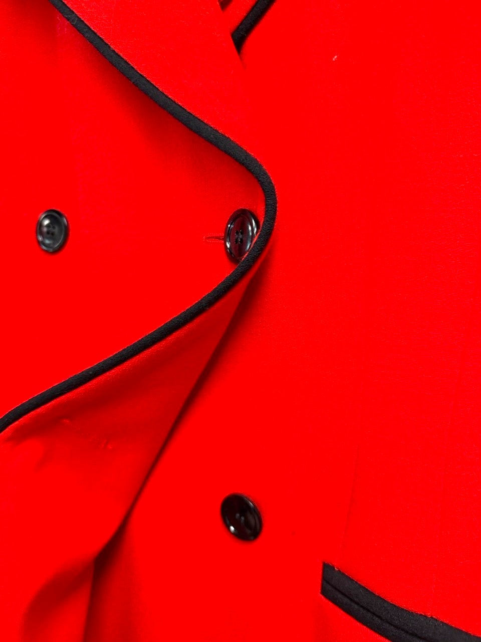 BERLIN VINTAGE CORNER vibrant red double-breasted wool blend blazer with black piping and button details.