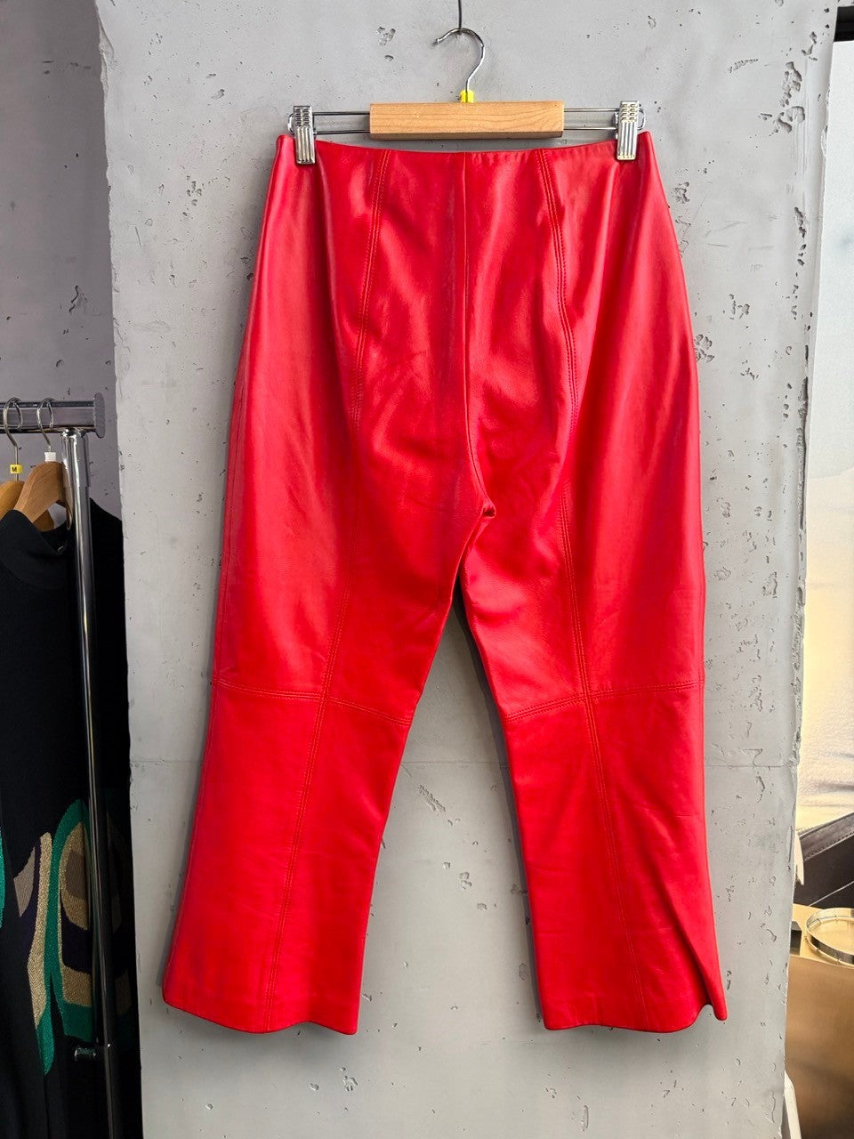 BERLIN VINTAGE CORNER red leather cropped pants with meticulous stitching and a flattering fit.