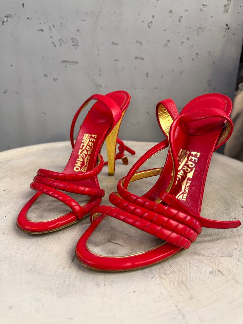 BERLIN VINTAGE CORNER red leather strappy high heel sandals with gold heel and braided detail.