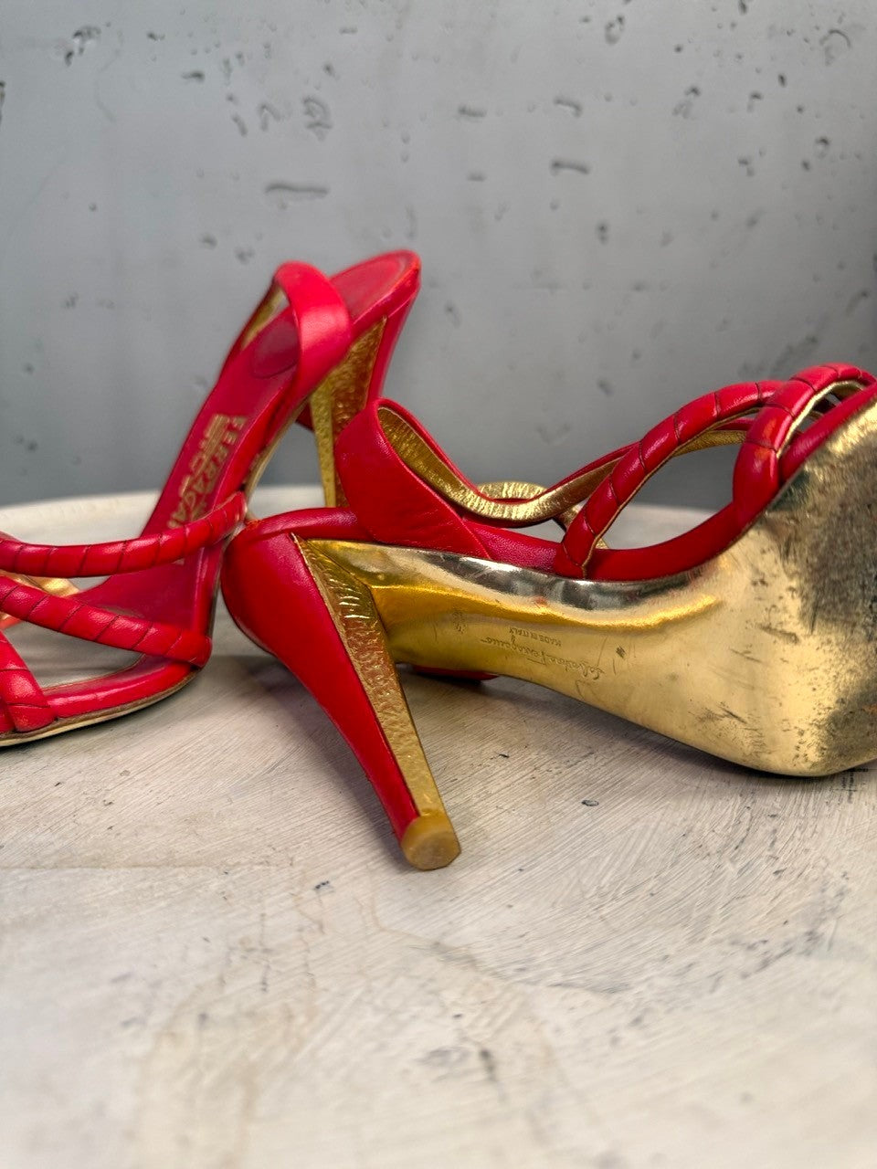 BERLIN VINTAGE CORNER red leather strappy high heel sandals with gold accents and braided detail.