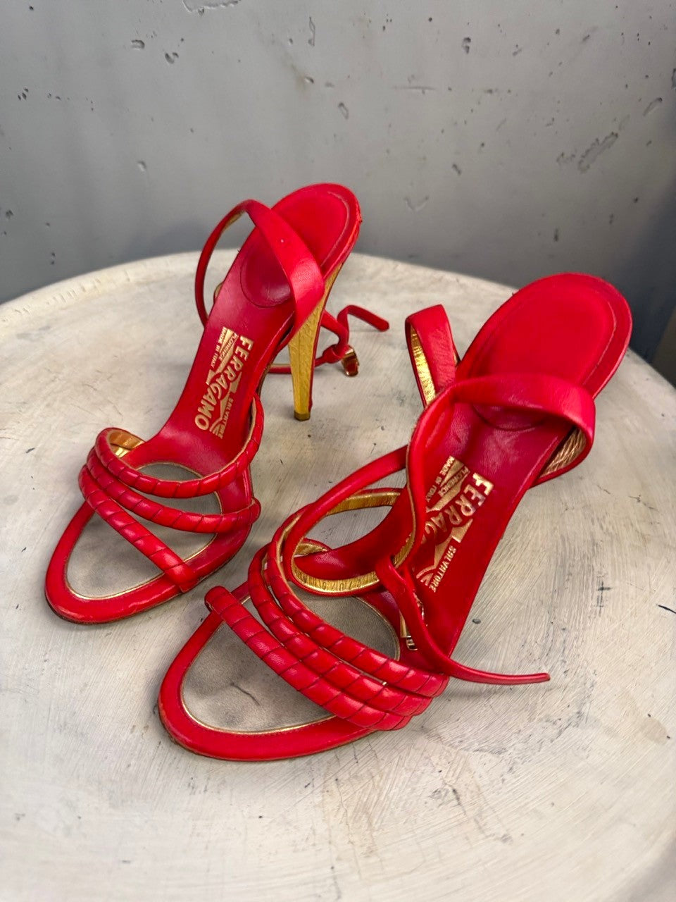BERLIN VINTAGE CORNER red leather strappy high heel sandals with gold detailing and ankle strap.