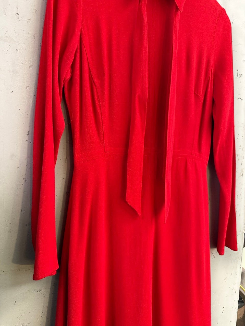 BERLIN VINTAGE CORNER red long sleeve mini dress with tie neck detail and fitted waist