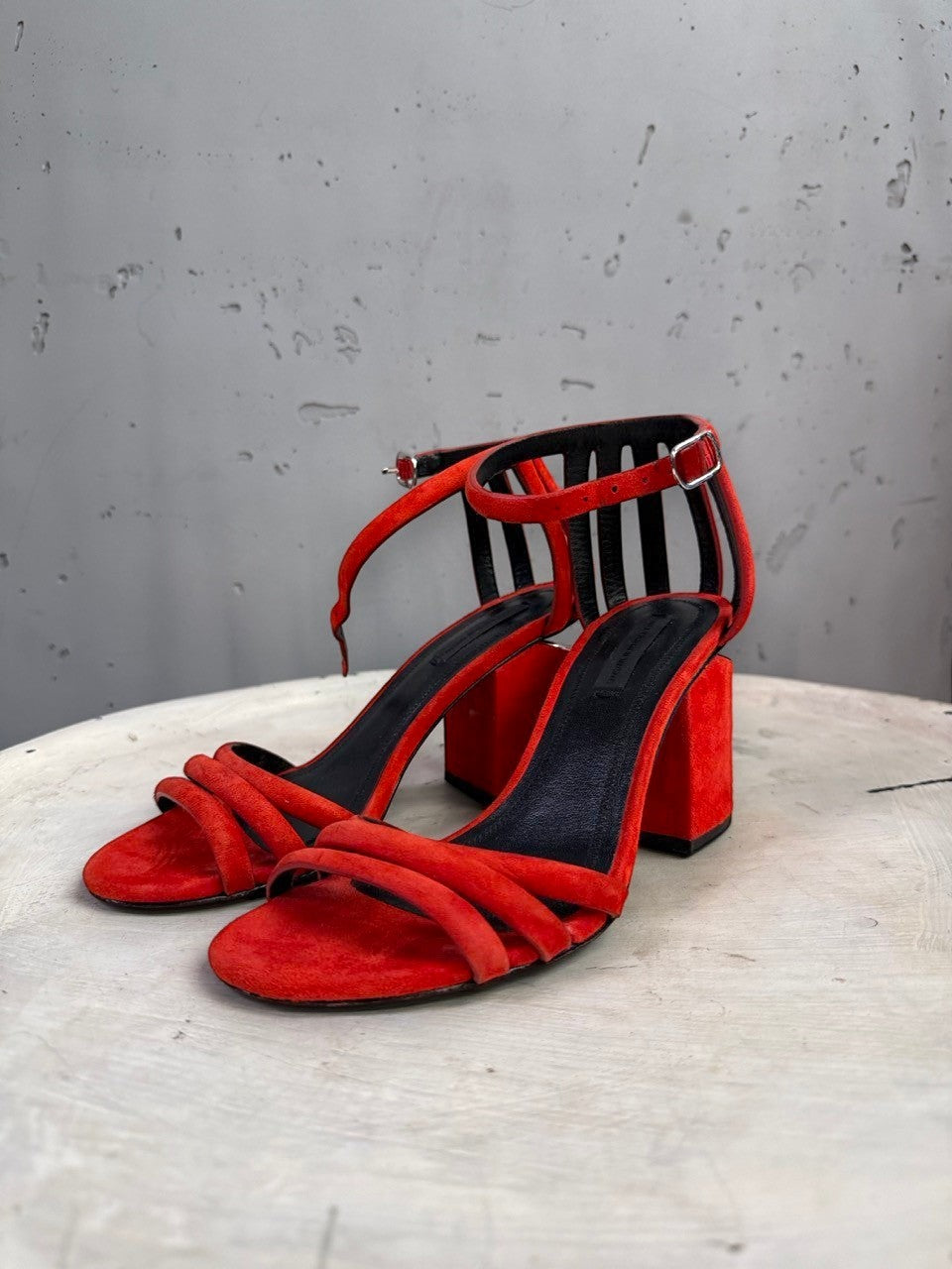 BERLIN VINTAGE CORNER Alexander Wang red suede block heel sandals with cage-style ankle straps and metallic heel detail.