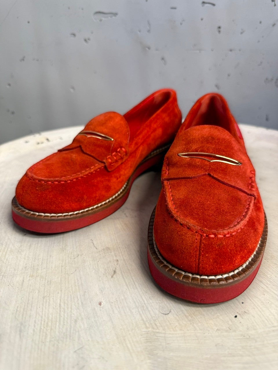 BERLIN VINTAGE CORNER Louis Vuitton red suede penny loafers with gold metal vamp accent and thick durable soles.