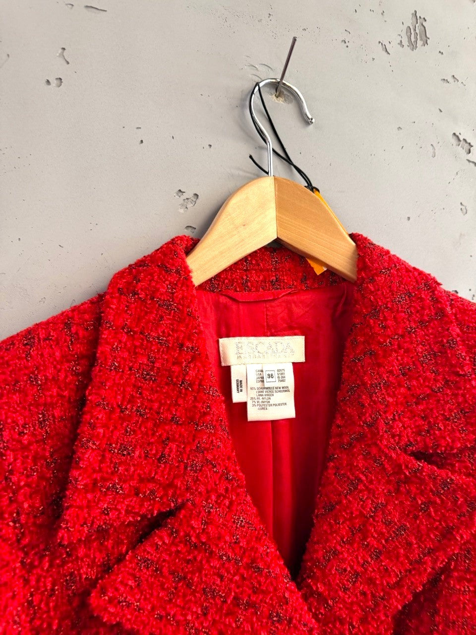 BERLIN VINTAGE CORNER red textured tweed blazer with dark thread accents and single button closure.
