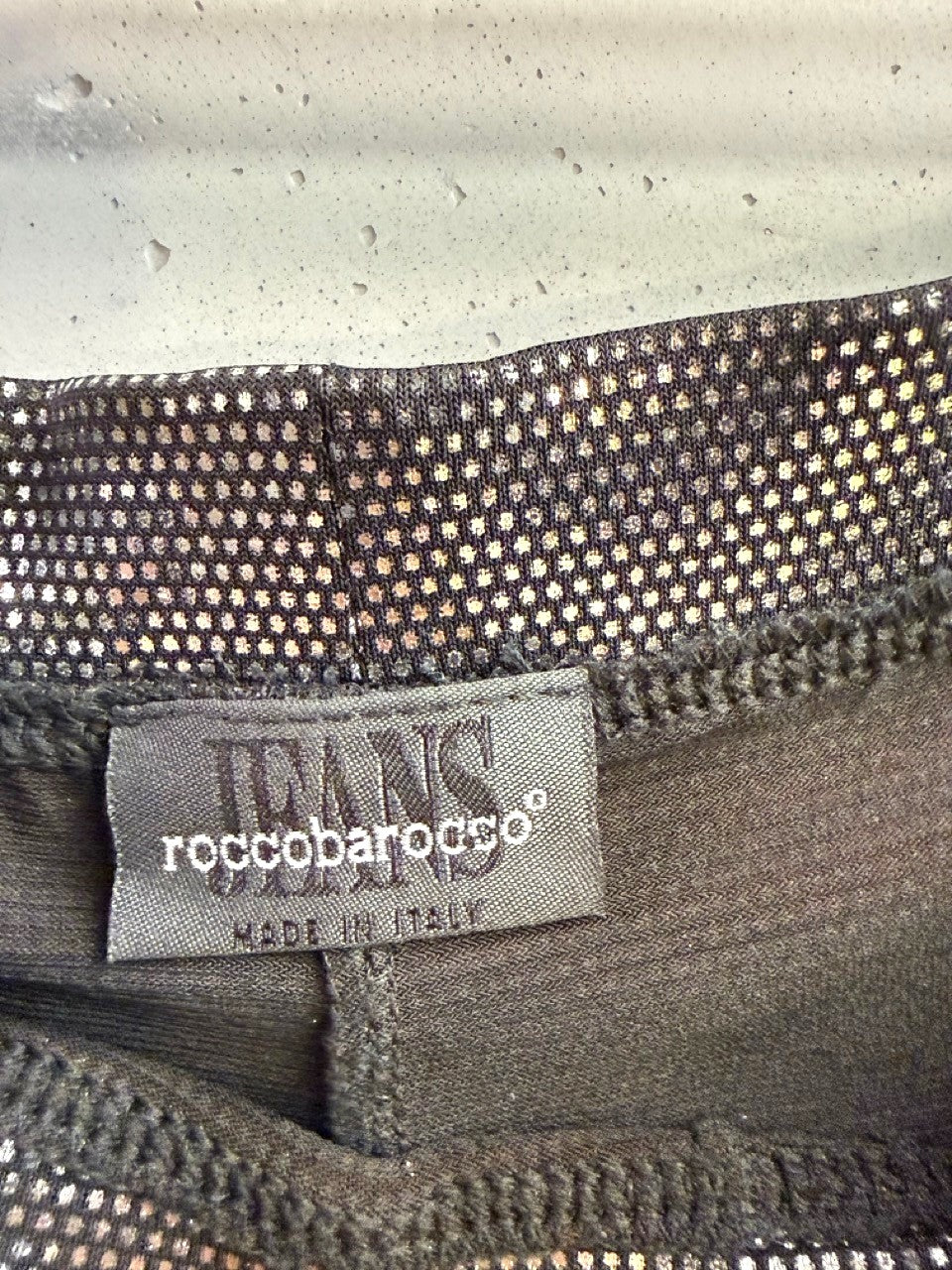 BERLIN VINTAGE CORNER roccobarocco Jeans metallic silver corset top label detail showing Italian craftsmanship